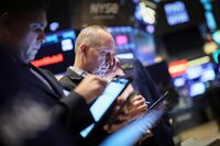 Traders work on the floor at the New York Stock Exchange (NYSE) in New York City, U.S., May 8, 2024.  REUTERS/Brendan McDermid/File Photo