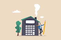 House mortgage calculation, residential budget, insurance or cost and expense, real estate investment or home decoration money concept, businessman agent or broker holding pencil with house calculator