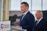 Minister of Tourism, Culture and Gaming Stan Cho, left, speaks to media alongside Ontario Premier Doug Ford at the construction site of the future Ontario Place and science centre in Toronto, on Thursday, Feb. 26, 2026. THE CANADIAN PRESS/Sammy Kogan