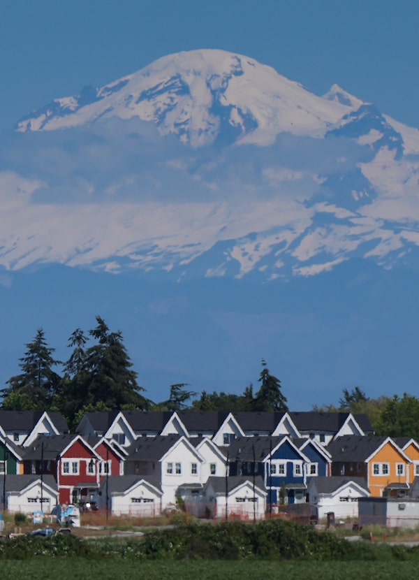 These townhomes in Delta, B.C., shadowed by Mount Baker in the distance,  are recent arrivals to a B.C. real-estate market that has gradually come down from speculative highs.