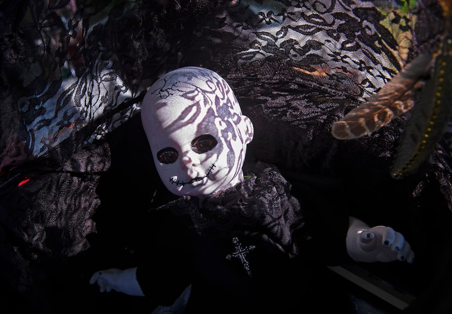 Lacy shadows fall on a puppet during the Wave Gothic Festival in Leipzig, Germany, in June, 2019.
