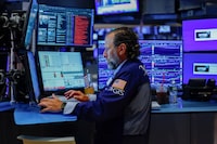 A trader works on the floor of the New York Stock Exchange (NYSE) in New York City, U.S., August 4, 2026 