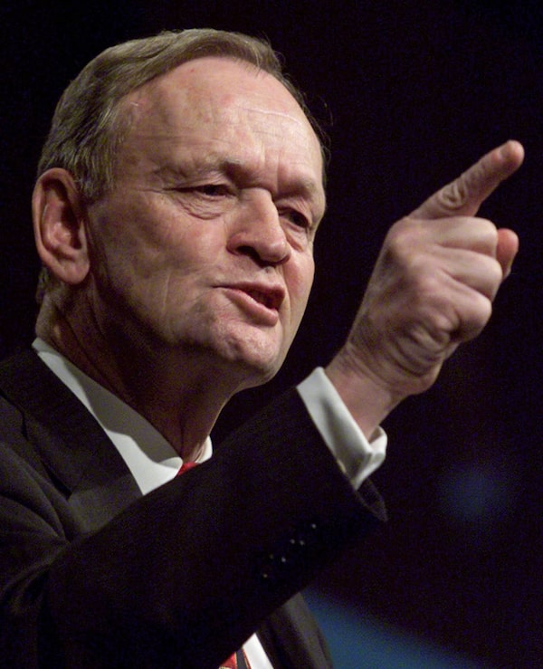 Prime Minister Jean Chretien gesture during his speech to Liberal members a dinner in Calgary Thursday March 23, 2000. (CP PHOTO/Adrian Wyld)
