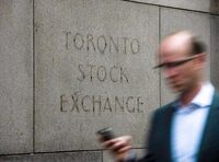 A man walks past a building in Toronto that used to house the Toronto Stock Exchange on August 18 2011. 