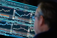 Financial information is displayed on the floor at the New York Stock Exchange in New York, Wednesday, March 4, 2026. (AP Photo/Seth Wenig)