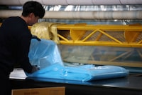 An employee works at a plastic film factory in Ansan, South Korea, March 25, 2026. REUTERS/Kim Hong-Ji