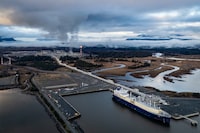 Wudang, a liquefied natural gas (LNG) tanker, fills up at an LNG Canada facility, in an aerial view, in Kitimat, B.C., on Thursday, November 13, 2025. THE CANADIAN PRESS/Ethan Cairns
