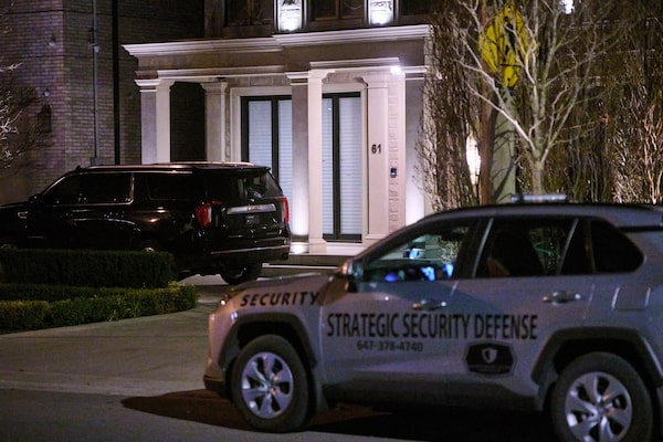 A private security vehicle guards the midtown Toronto home of Sean Goldberg, an executive with GIP, after it was the site of a targeted shooting in March, 2026.