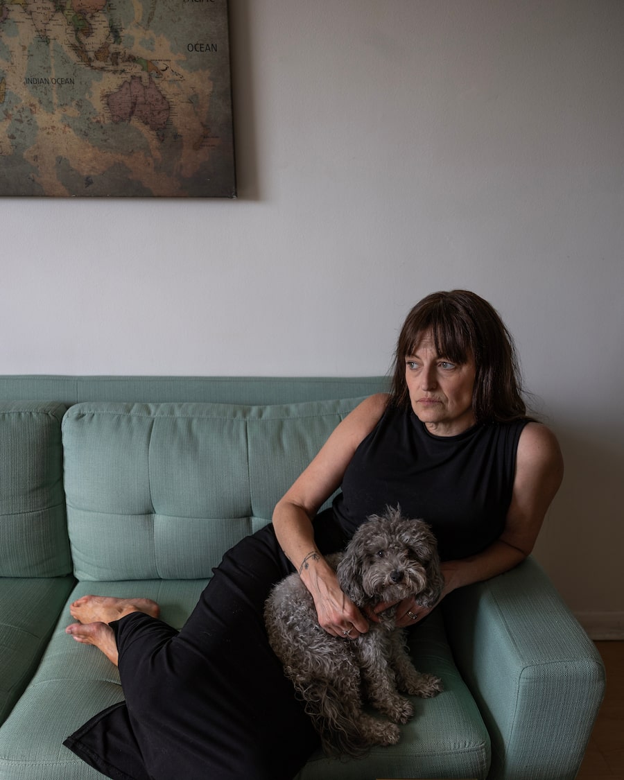 Claire Brosseau and her beloved dog Olive, at home in Toronto. Ms. Brosseau is fighting for access to MAID for the sole medical reason of mental illness.