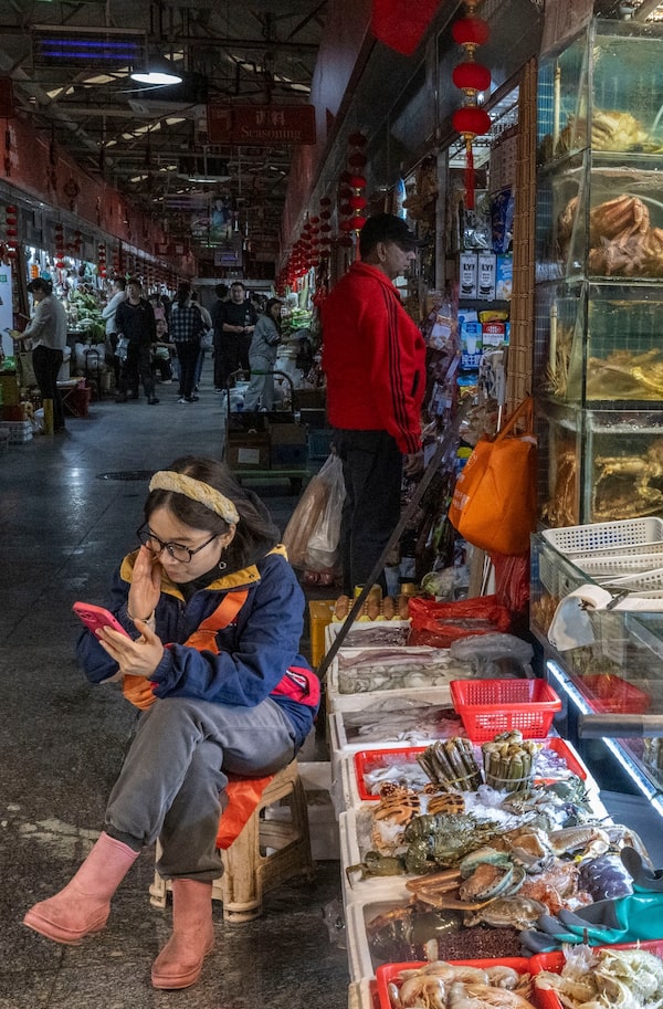 The vendor at this Beijing fish-market stall says he has lobster from Canada, which is rarer in China these days. Tariffs made the country less accessible to North American producers of seafood and many other goods.