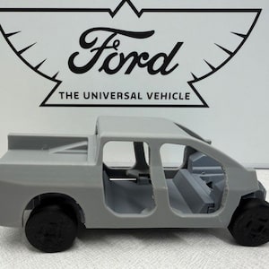 Ford gave journalists a small 3D-printed model of the shell of its next EV. It doesn't have much detail and is missing the front end – but it's definitely a truck.