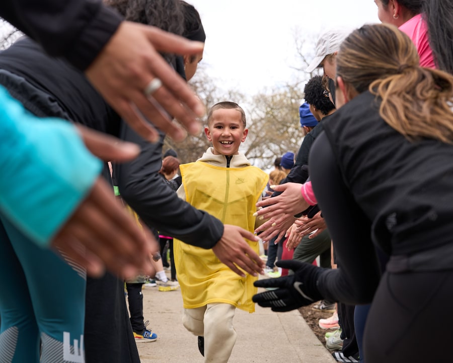 Amari Zedan, 7, runs through a cheer tunnel at the end of a 3.5-kilometre run. He’s part of Toronto’s Kickback Run Club, where participants of all ages and backgrounds gather weekly to get their steps in and cheer each other on.