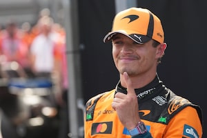 McLaren driver Lando Norris of Britain celebrates after winning the qualifying session ahead of Sunday's Formula One Hungarian Grand Prix auto race, at the Hungaroring racetrack in Mogyorod, near Budapest, Hungary, Saturday, July 25, 2026. (AP Photo/Darko Vojinovic)