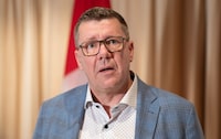 Saskatchewan Premier Scott Moe speaks with reporters in Mumbai, India, Friday.