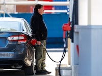 A person pumps gas at a gas station in Ottawa last week.
