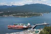 Crude oil tankers SFL Sabine, front left, and Tarbet Spirit are seen docked at the Trans Mountain Westridge Marine Terminal, where crude oil from the expanded Trans Mountain Pipeline is loaded onto tankers, near a residential area in Burnaby, B.C., Monday, June 10, 2024. THE CANADIAN PRESS/Darryl Dyck