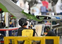 A Bombardier assembler works on the wing of a Challenger aircraft at their production facility in Dorval, Quebec, on Monday, June 22, 2026.  