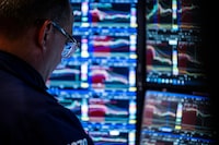 Traders work on the New York Stock Exchange floor on a Friday afternoon, Aug. 15, 2025. The S&P 500 has continued to hit new highs, and for the time being, the economic reality of tariffs has yet to catch up with the marketÕs earlier worries. (Karsten Moran/The New York Times)