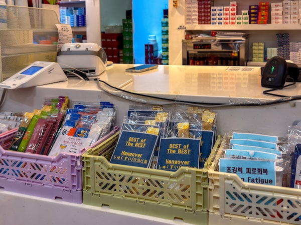 A pharmacy in the Seoul neighbourhood of Myeongdong advertises a "best of the best" package of hangover cures for local and foreign customers.