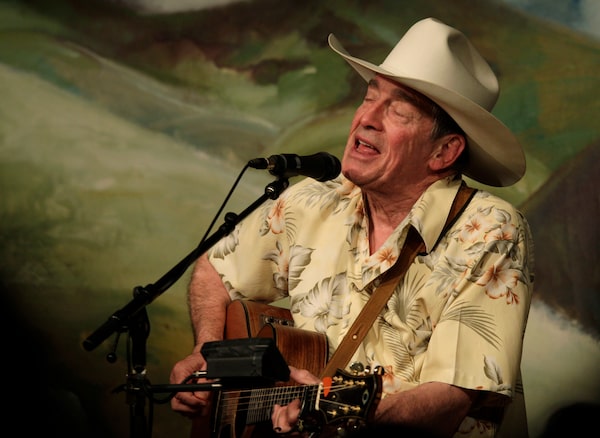 FILE -Legendary Canadian singer-songwriter Ian Tyson, center, performs at the Western Folklife Center during the 28th annual National Cowboy Poetry Gathering, Thursday, Feb. 2, 2012, in Elko, Nev. Ian Tyson, the Canadian folk singer who wrote the modern standard “Four Strong Winds” as one half of Ian & Sylvia and helped influence such future superstars as Joni Mitchell and Neil Young, died Thursday, Dec. 29, 2022 at age 89. (AP Photo/Ted S. Warren, File)