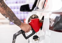 A person pumps gas in Montreal on Thursday, April 2, 2026. THE CANADIAN PRESS/Christinne Muschi