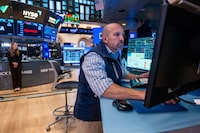 NEW YORK, NEW YORK - AUGUST 06: Traders work on the New York Stock Exchange (NYSE) on August 06, 2026 in New York City. The Dow was down slightly in morning trading as investors continue to watch events in Iran and their effects on global markets.  (Photo by Spencer Platt/Getty Images)
