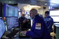 Traders work on the floor at the New York Stock Exchange (NYSE) in New York City, U.S., April 23.