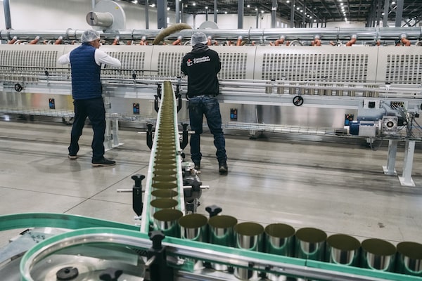 Employees work on the production line at Ideal Can in Saint-Apollinaire, Qué, in April, 2025.