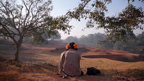 To Kill a Tiger (Documentary). Caption: Ranjit’s daughter looking out in a field. In a small Indian village, Ranjit wakes up to find that his 13-year-old daughter has not returned from a family wedding. A few hours later, she’s found stumbling home. After being dragged into the woods, she was raped by three men. Ranjit goes to the police, and the men are arrested. But Ranjit’s relief is short-lived, as the villagers and their leaders launch a sustained campaign to force the family to drop the charges. "To Kill a Tiger" follows Ranjit’s uphill battle to find justice for his child. Credit: Courtesy of the NFB and Notice Pictures Inc.