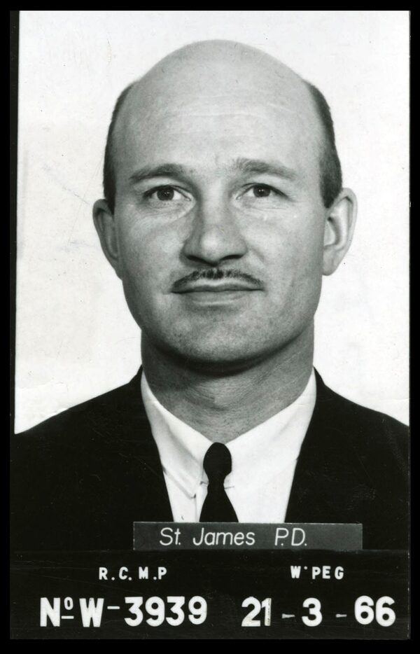 Kenneth "Ken" Leishman mugshot. The annotated back of a photograph from September 3, 1966 of "the Flying Bandit" Kenneth Leishman, taken by the St. James Police Department after arresting him for the Winnipeg gold heist. He escaped from prison shortly thereafter. Credit: University of Manitoba Libraries