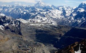 An aerial view of the open pit of Anglo American's Los Bronces copper mine with Aconcagua mount (C) in the background, America's highest peak in the Andes mountain range, and several glaciers, near Santiago city, November 17, 2014. REUTERS/Ivan Alvarado/ File Photo