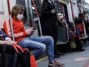 Riders take a subway train on the Toronto Transit Commission station in downtown Toronto, Saturday, April 1, 2023. Canada's industry minister is calling on the country's biggest telecom companies to come to an agreement over wireless service in Toronto's subway system. THE CANADIAN PRESS/Cole Burston